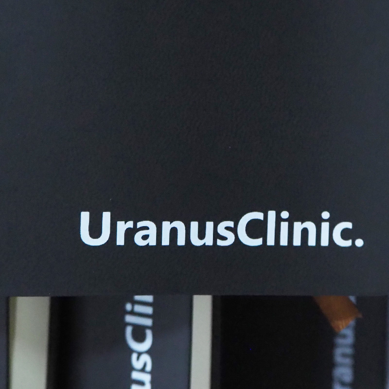 ผลงานของพรีเมี่ยม สมุดโน้ต สกรีนโลโก้ UranusClinic